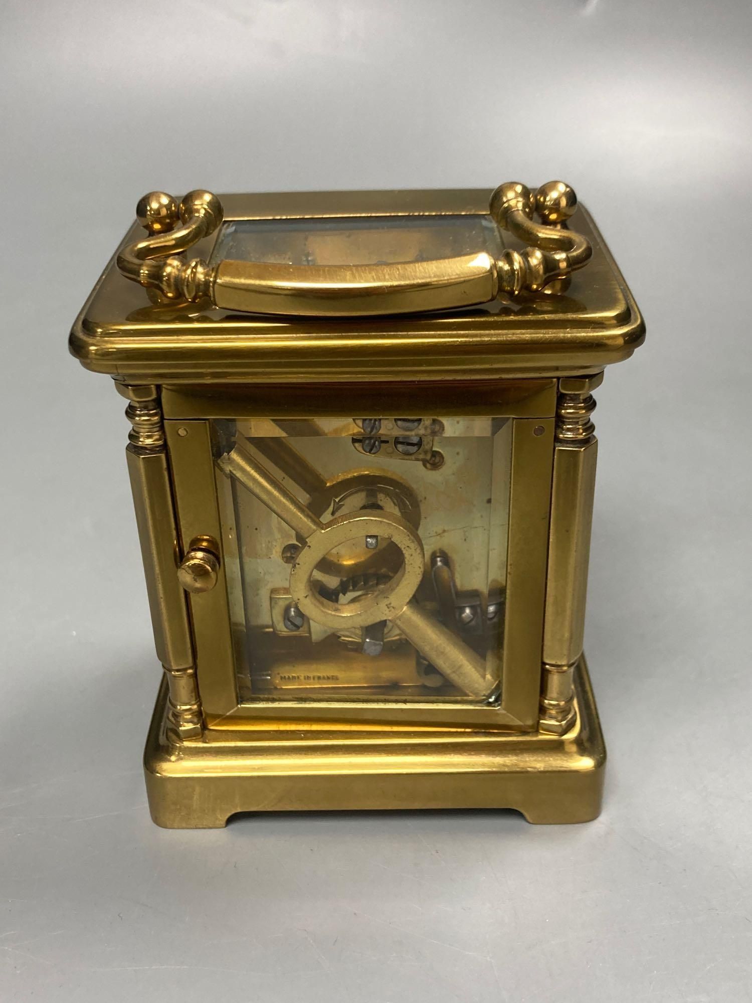 A late 19th century French brass carriage timepiece, 13cm high to handle